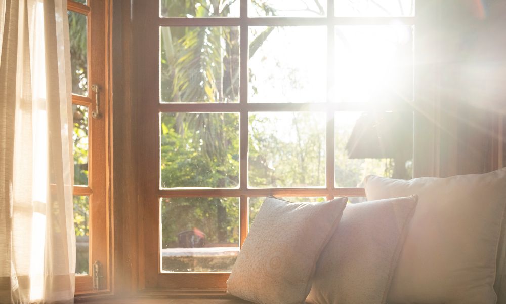 sun shining through old wood window needing Houston window repair